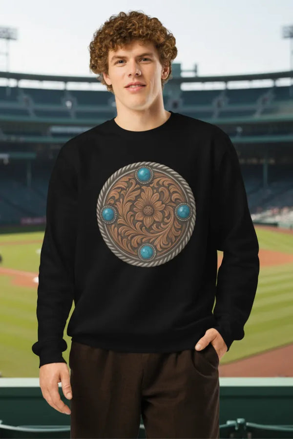 Person wearing a black sweatshirt with a decorative emblem on a sports field background