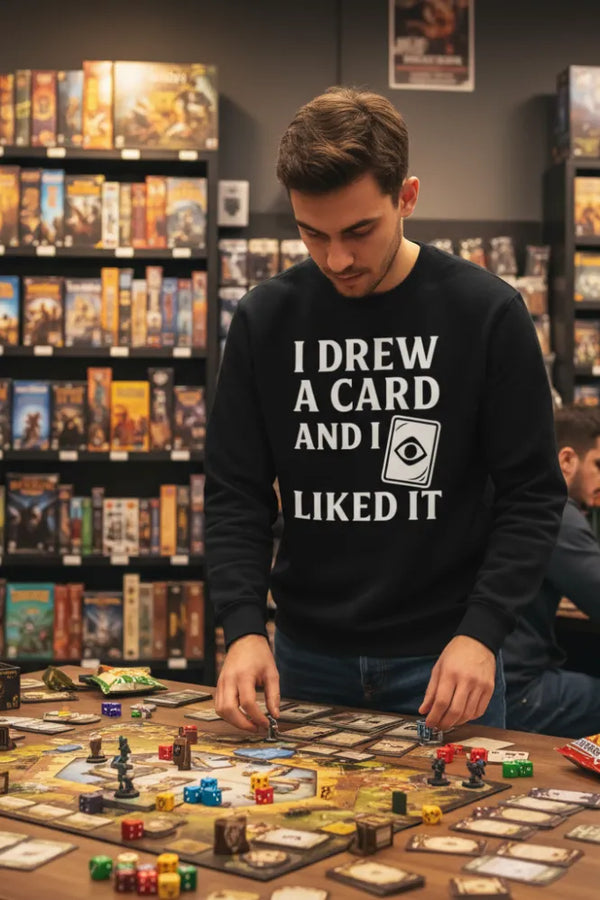 Man playing a board game in a store with shelves of board games in the background.