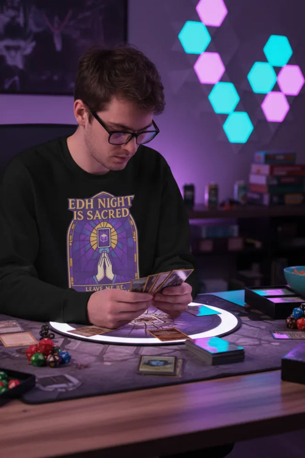 Person playing card game with colorful lights in the background