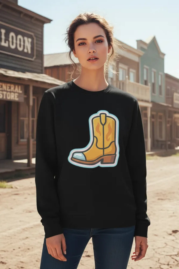 Woman wearing a black sweatshirt with a yellow boot graphic in front of a western-style building.
