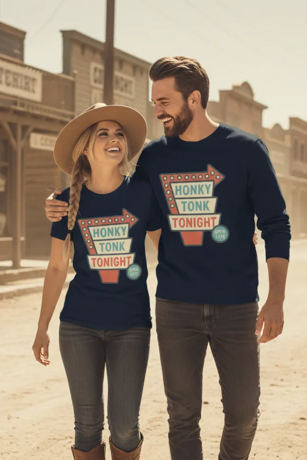 Two people wearing 'Honky Tonk Tonight' shirts in a western-themed setting.