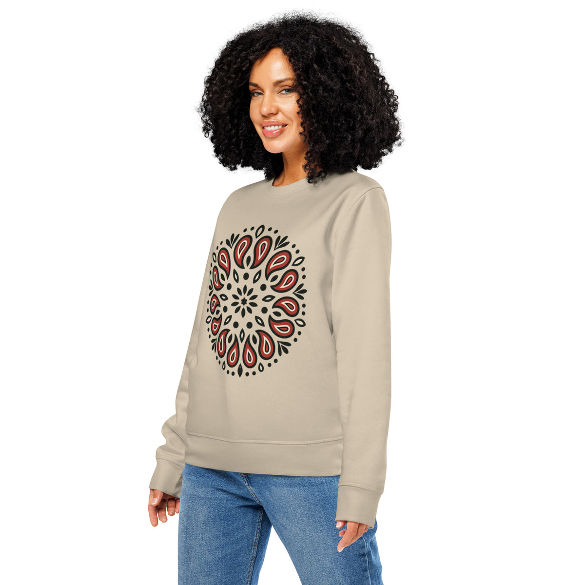 Woman wearing a beige sweatshirt with a red and black pattern on a white background