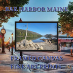 Framed canvas print of Bar Harbor, Maine’s Jordan Pond, featuring a solitary tree, rocky shoreline, and calm reflective water with surrounding mountains.