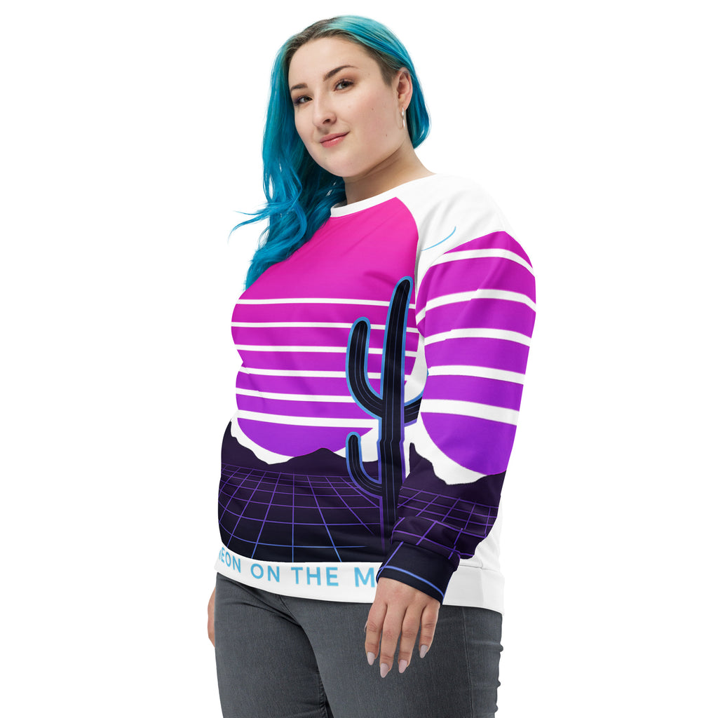 Person wearing a colorful striped sweater with a cactus design on a white background