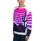 Person wearing a sweater with a cactus design and text on a white background