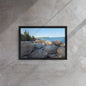 Framed canvas print of Bar Harbor, Maine’s rocky shoreline with blue ocean waves and a forested coastline in the background, set against a scenic downtown backdrop.