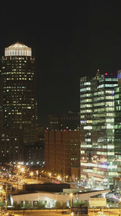 Nighttime cityscape of Boston featuring illuminated landmarks and a serene skyline, perfect for adding a touch of urban elegance to your home decor.