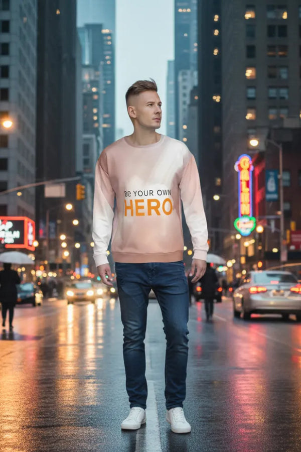 Man wearing a sweatshirt with motivational text on a city street at night.