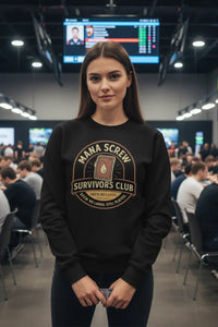 Person wearing a black sweatshirt with 'Mana Screw Survivors Club' design in an indoor setting.
