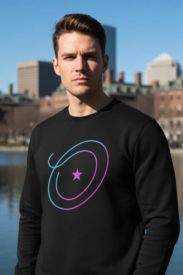Man wearing a black sweatshirt with a colorful design in an urban setting