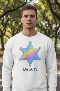 Man wearing a white sweatshirt with a rainbow star of David and 'Deputy' text, standing outdoors.