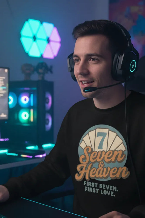 Person wearing headphones and a 'Seven & Heaven' shirt in a gaming setup with colorful lights.