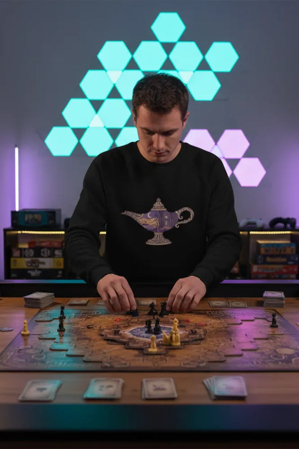 Man playing a board game with colorful geometric light display in the background