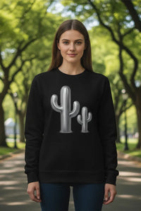 Person wearing a black sweatshirt with a cactus design in a park setting