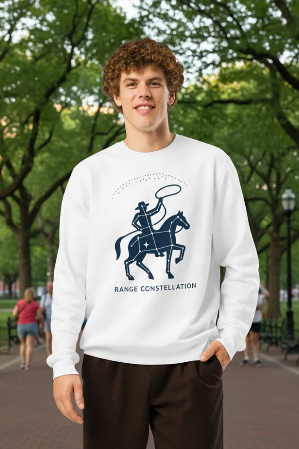 Person wearing a white sweatshirt with a graphic design outdoors