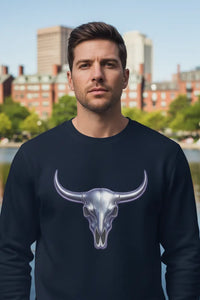 Man wearing a black sweatshirt with a bull skull design outdoors.