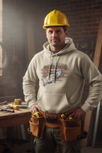 Man wearing a yellow hard hat and tool belt with a workshop background