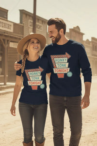 Two people wearing 'Honky Tonk Tonight' shirts in a western-themed setting.