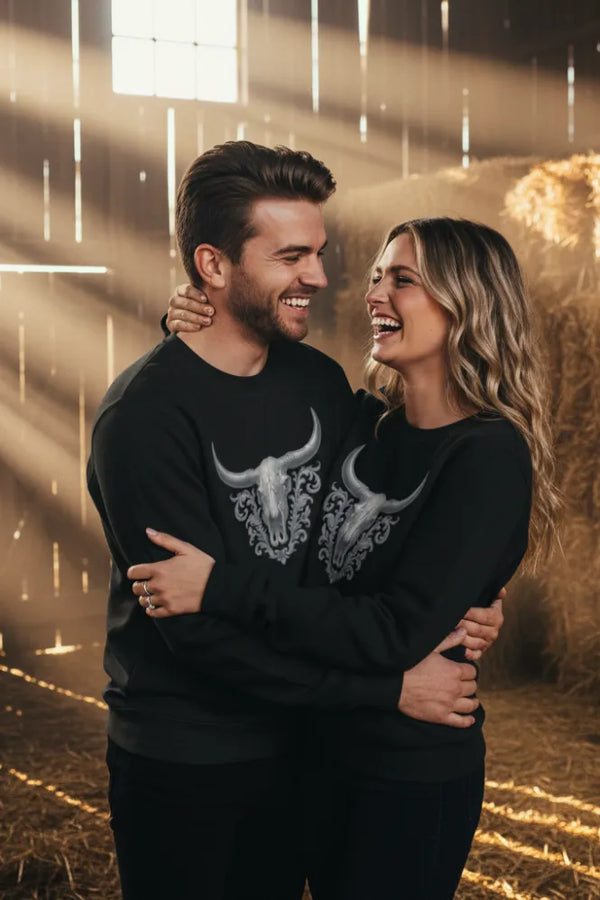 Couple embracing in a warm, softly lit indoor setting