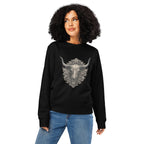 Woman wearing a black sweatshirt with a decorative bull skull design on a white background