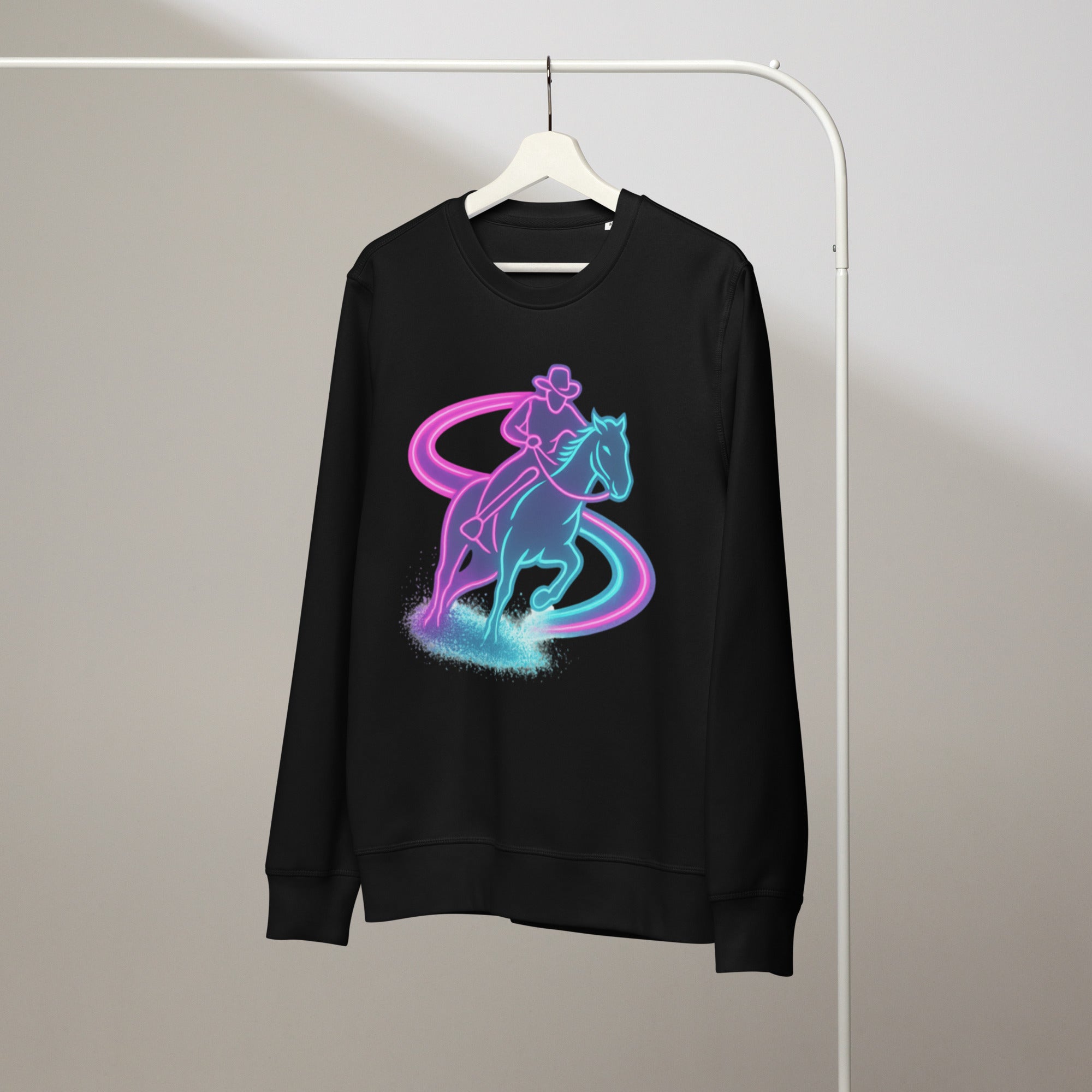 Black sweatshirt with a colorful graphic of a person riding a horse on a hanger against a plain background.
