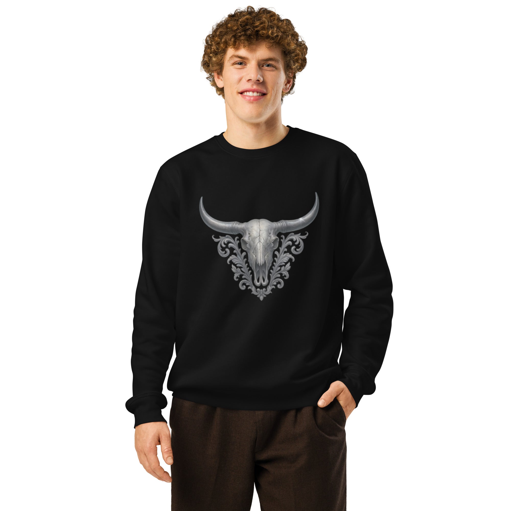 Person wearing a black sweatshirt with a bull skull design on a white background