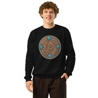 Person wearing a black sweatshirt with a decorative emblem on a white background