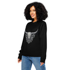 Woman wearing a black sweatshirt with a bull skull design on a white background