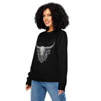 Woman wearing a black sweatshirt with a bull skull design on a white background