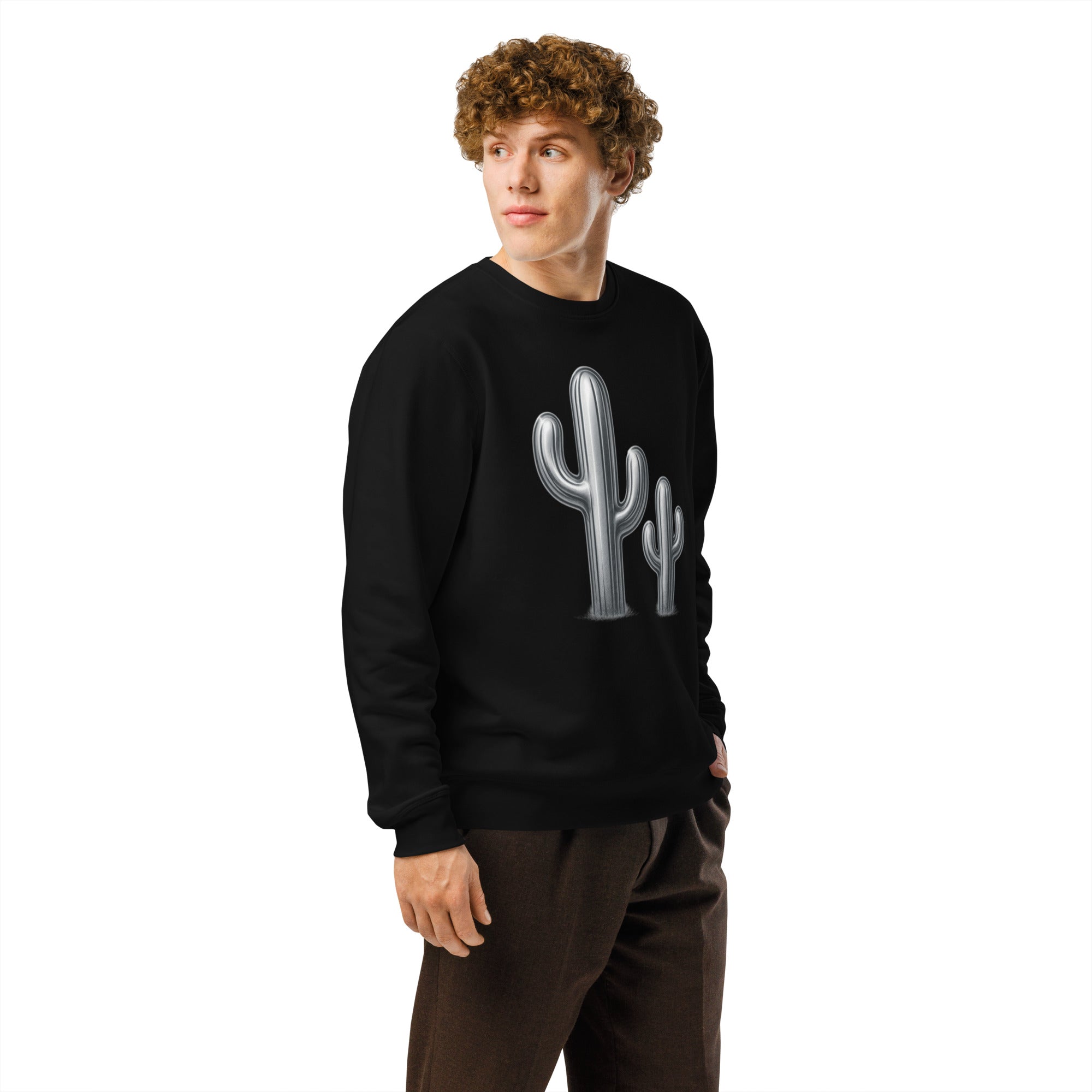 Person wearing a black sweatshirt with a cactus design on a white background