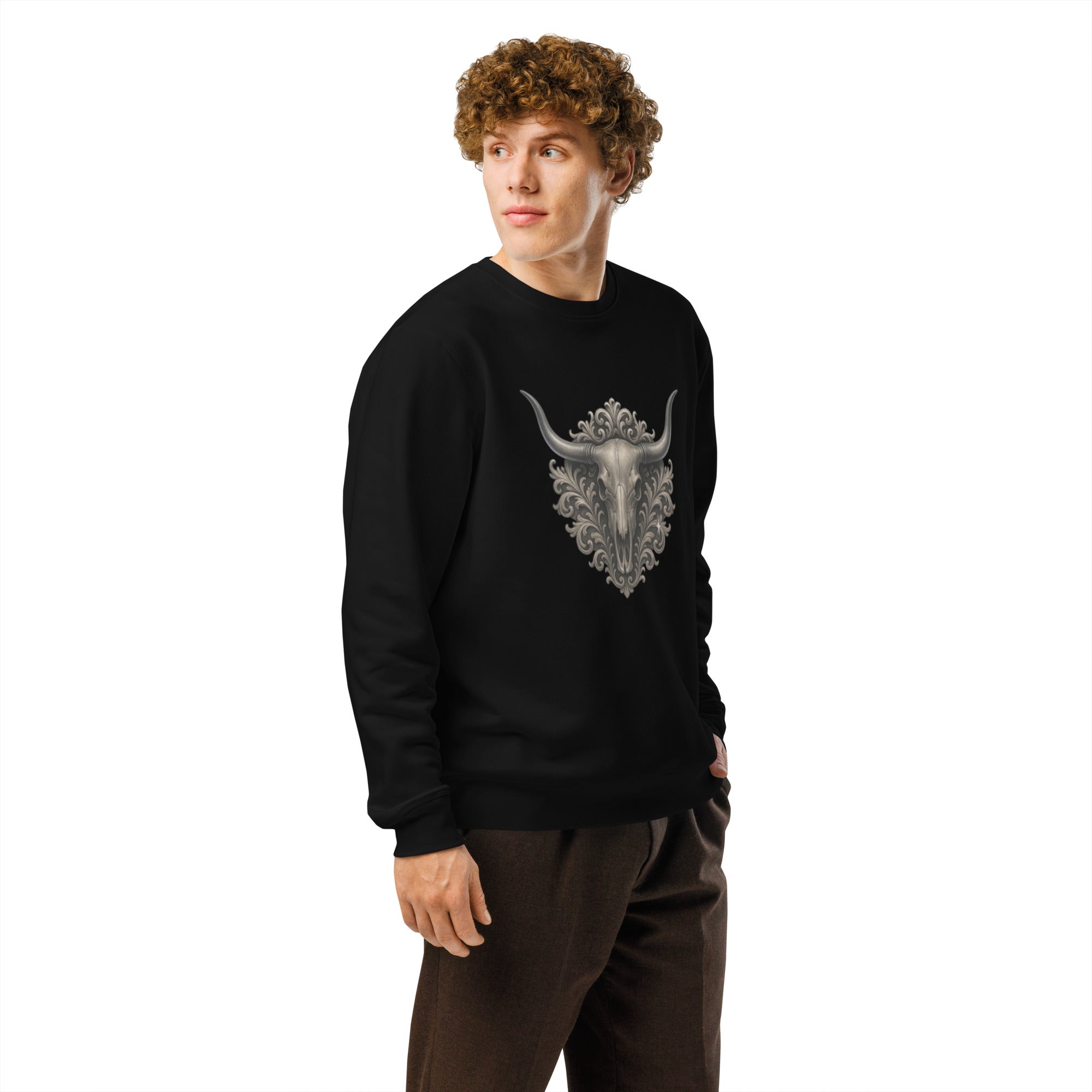 Person wearing a black sweatshirt with a bull skull design on a white background