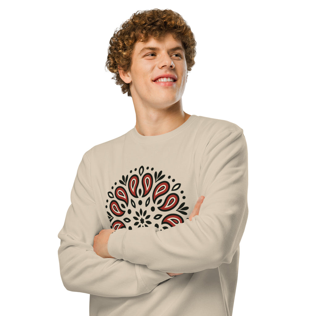 Man wearing a beige long-sleeve shirt with a black and red pattern on a white background