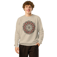 Man wearing a beige sweatshirt with a red and black pattern on a white background