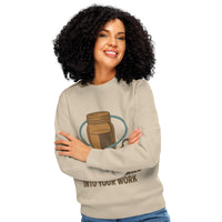 Woman wearing a beige sweatshirt with a design and text on a white background