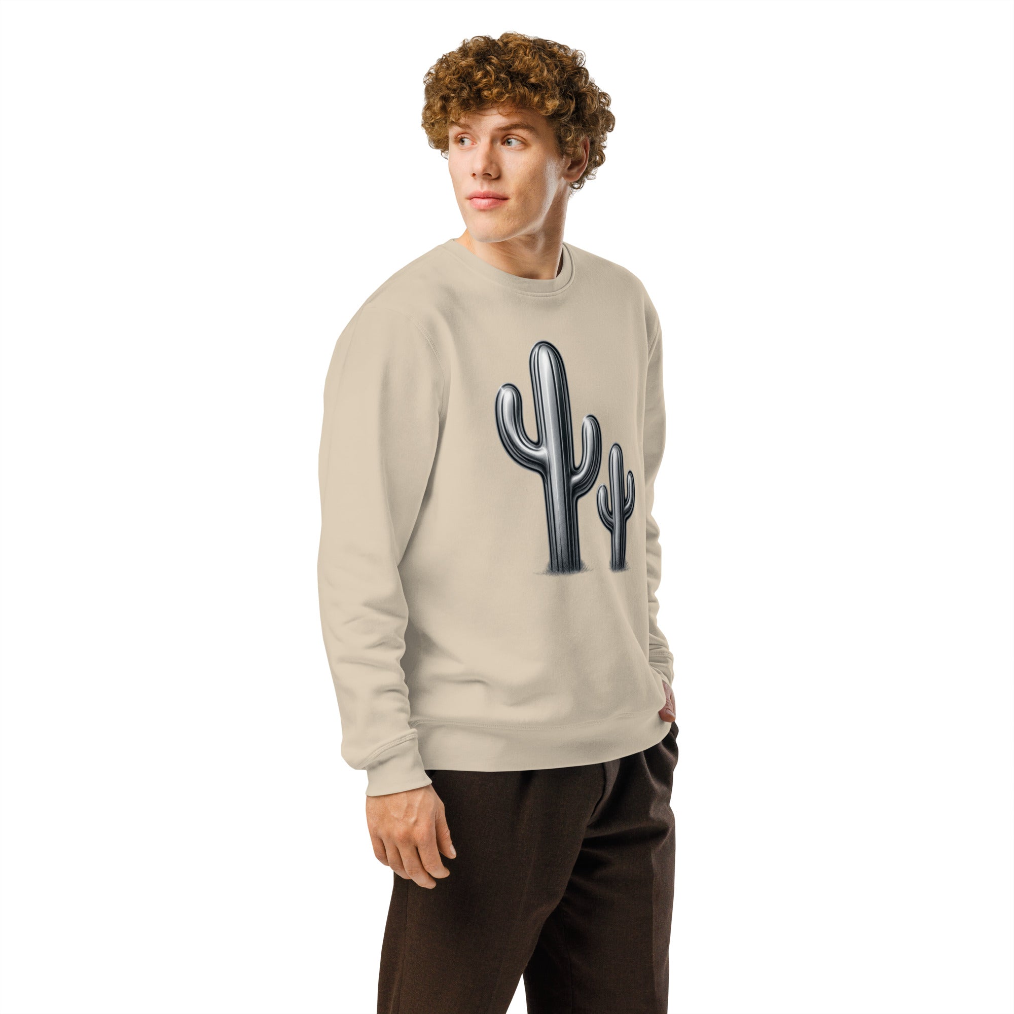 Person wearing a beige sweatshirt with a cactus design on a white background