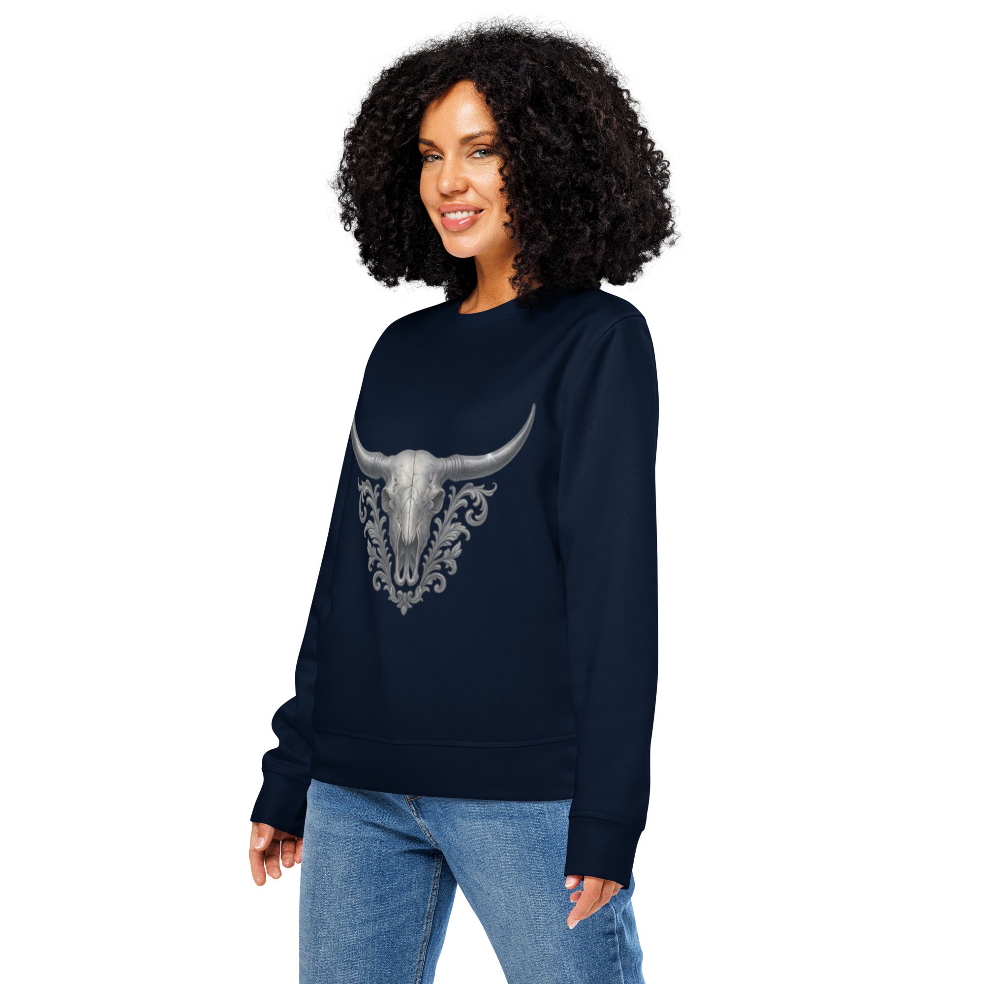 Woman wearing a navy blue sweatshirt with a bull skull design on a white background