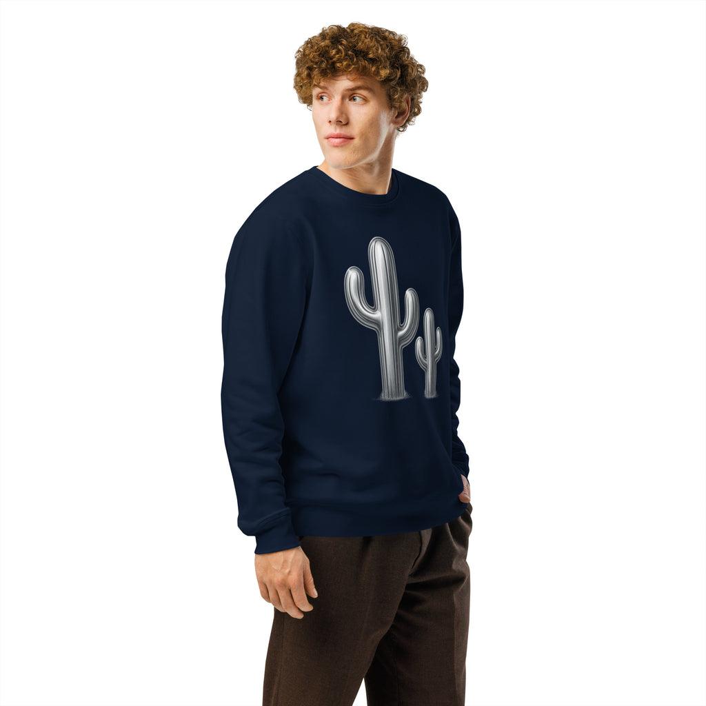 Person wearing a navy blue sweatshirt with a cactus design on a white background