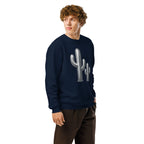 Person wearing a navy blue sweatshirt with a cactus design on a white background